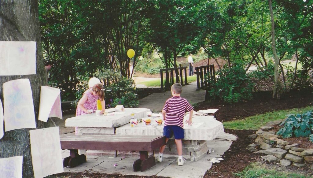 Bruce Bennett's children's table at UT Gardens with Children
