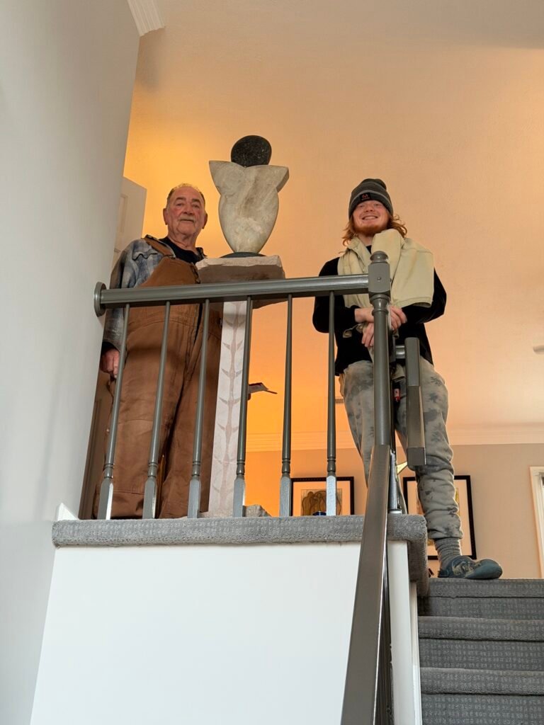 Gary's Bruce Bennett Sculpture Aya with Charlie and Nate installing at the tip of the stairs.