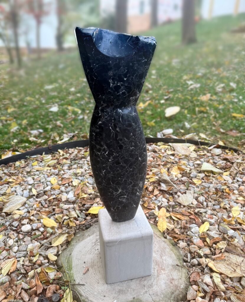 Image of Black marble torso by Bruce Bennett in Christian's Garden