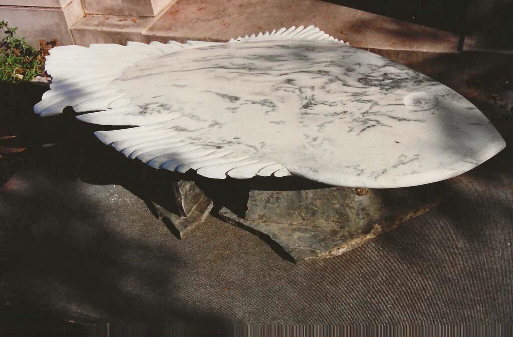 Carved fish table by Bruce Bennett in white Montclair Danby marble.