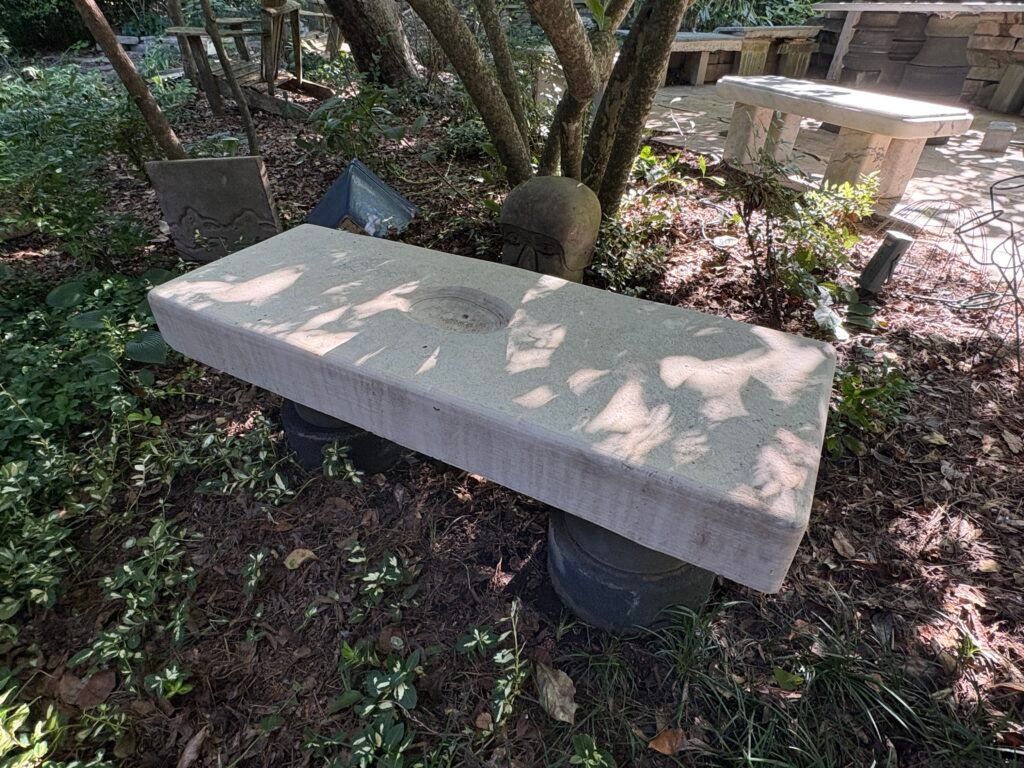 Limestone bench by Bruce Bennett