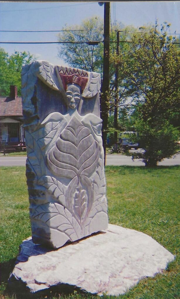 Jane Carter Buis’s Nature Queen of Everything, a carved Tennessee marble sculpture depicting a female figure surrounded by organic forms.