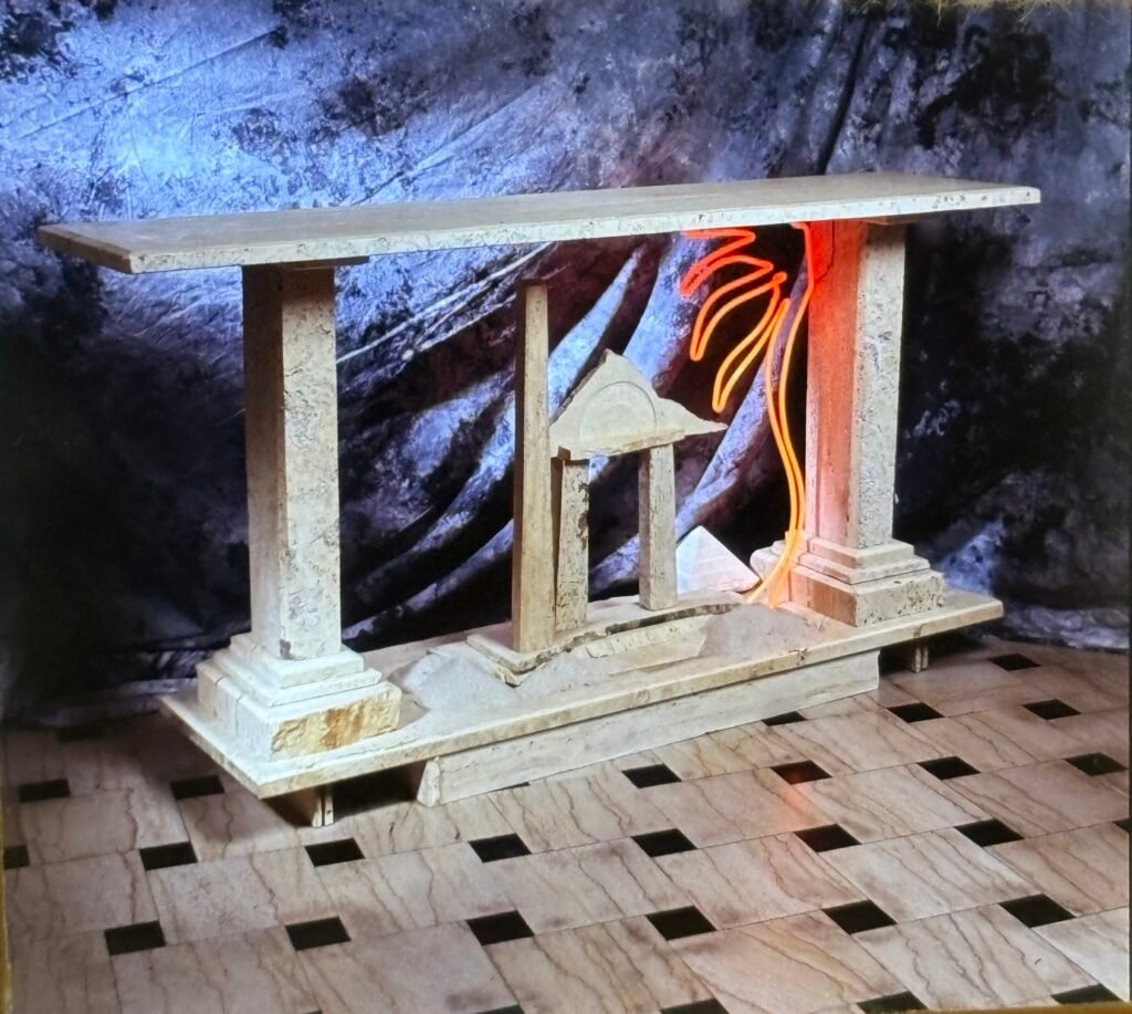 Bruce Bennett architectural stone table featuring classical columns, a carved temple, and integrated neon.