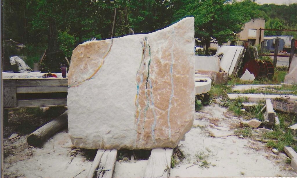 Jessie Calder’s Reflection, a Tennessee marble sculpture embellished with acid treatment and mosaic tile during the 2003 One-Ton Symposium.