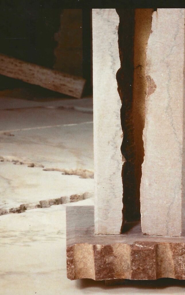 Artist detail showing finished and natural stone edges in the base of Bruce Bennett’s sculptural marble table.