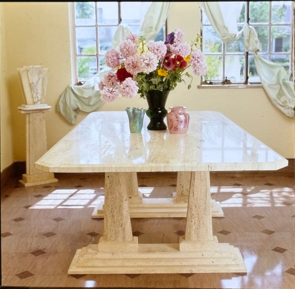 White marble table by Bruce Bennett and handblown glass by Connie Christopher.